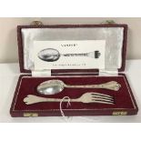 A cased pair of silver spoons and matching silver fork,