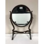 A late Victorian mahogany toilet mirror and a brass table lamp