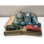 Twelve boxed Scalectric racing cars ,