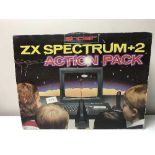 A boxed Sinclair ZX Spectrum + 2 Action Pack