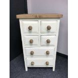 A painted pine chest of six drawers, width 55 cm.