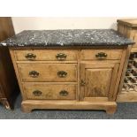 A walnut marble-topped cabinet, fitted with a cupboard and four drawers, width 107 cm.