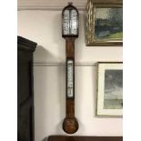 A 19th Century walnut stick barometer.