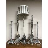 Three table lamps (one shade) and a pair of chrome candlesticks