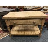 A reclaimed pine butcher's block, fitted with a drawer, with undershelf, width 111 cm.