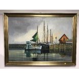 A gilt framed oil on canvas depicting fishing boats,