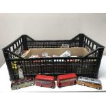 A crate of die cast vehicles and buses