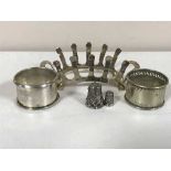 A silver toast rack, silver napkin ring,