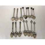 A set of four silver teaspoons, another set of six and a set of five coffee spoons, 4.