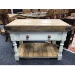 A reclaimed pine butcher's block, fitted with a drawer, on a painted base, with undershelf,