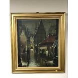 A gilt framed oil on canvas - figures on a street