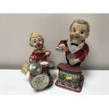 A tin plate battery operated bar tender and a tin plate clown playing the drums