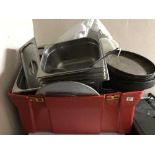 A tub of stainless steel bain marie pots,