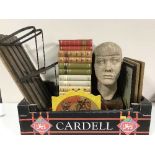 A box of framed pictures, pottery head sculpture, wooden paper rack,