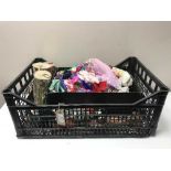 A box of assorted doll's clothing and accessories and assorted dolls of the world