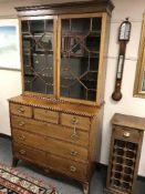 A George III style inlaid mahogany bookcase,