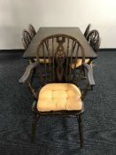 An oak refectory dining table and five chairs