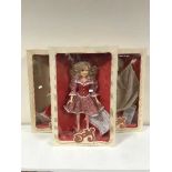 Three boxed Dolly Parton collector's dolls