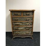A bamboo and wicker six drawer chest