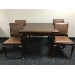 A mahogany dining room suite comprising of pull-out dining table,