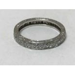 A platinum diamond eternity ring, size L.