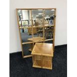 An oak revolving book stand and a pine framed section mirror
