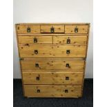 A pine nine drawer campaign style chest