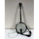 A Sheltone five string banjo,