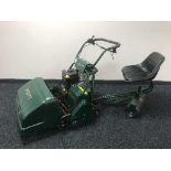 An Atco Royale 24E I-C petrol sit-on cylinder lawnmower, with tow-along seat and collection box.
