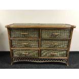 A bamboo and wicker six drawer low chest