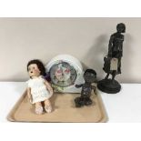 A painted mantel clock, two plastic dolls,