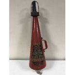 A vintage Minimax fire extinguisher and wall mount bracket