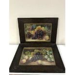 A pair of oak framed still life pictures depicting fruit together with framed and unframed prints -