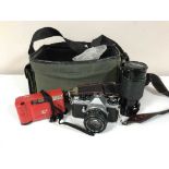 A camera bag containing Pentax ME Super camera, one other camera,