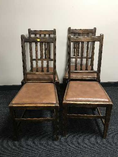 A set of four oak dining chairs