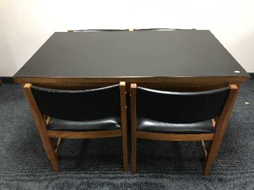 A 20th century teak kitchen table with cover and four chairs