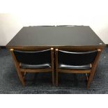 A 20th century teak kitchen table with cover and four chairs