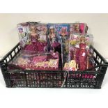 A basket of seven assorted boxed Barbie dolls
