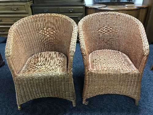 Two wicker basket chairs and a coffee table