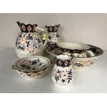 A six piece pottery blue and gilt with floral decoration toilet set