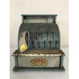 A child's Codeg tin plate cash register