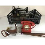 A Singer hand sewing machine, two bakelite telephones, telephone,