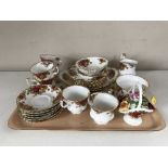 A tray of twenty eight pieces of Royal Albert Old Country Roses china and a Royal Stafford dish