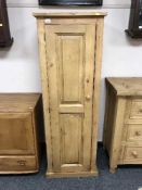 A reclaimed pine single door cabinet