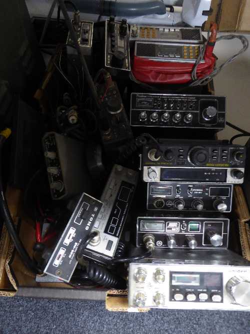 A box of assorted ham radio transceivers and Linear amps by Binatone, Hawk,