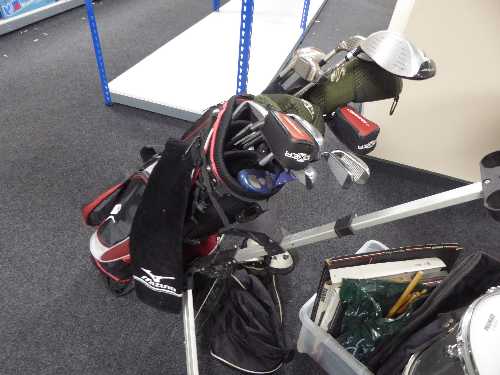 A Mizono golf bag and a part set of irons, Dunlop driver, Adams golf hybrid drivers,