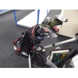 A Mizono golf bag and a part set of irons, Dunlop driver, Adams golf hybrid drivers,