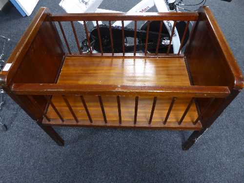 A stained beech wood cot