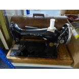 An oak cased Singer sewing machine