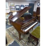 A Challen baby grand piano in mahogany case